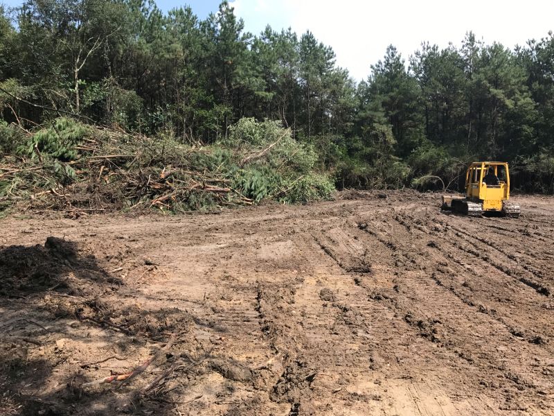 Prepares land for development